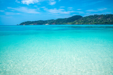 Crystal clear water of tropical island beautiful beach in sunny day - Summer breeze travel holiday concept.