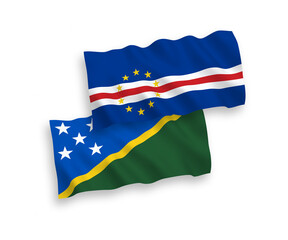 National vector fabric wave flags of Solomon Islands and Republic of Cabo Verde isolated on white background. 1 to 2 proportion.