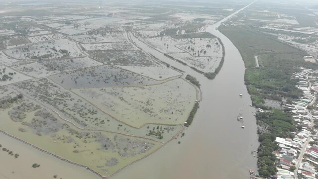 Aerial view of Mekong River delta region in Ha Tien, Vietnam, scenic river branches and water canals flooding on the rice fields