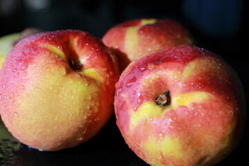 fresh nectarines in water drops