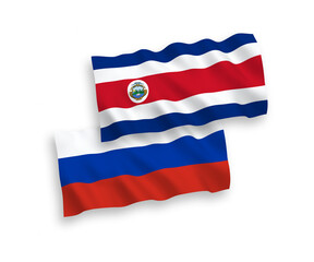 National vector fabric wave flags of Republic of Costa Rica and Russia isolated on white background. 1 to 2 proportion.