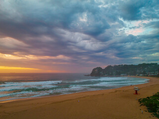 Sunrise reflections and clouds at the seaside with lagoon