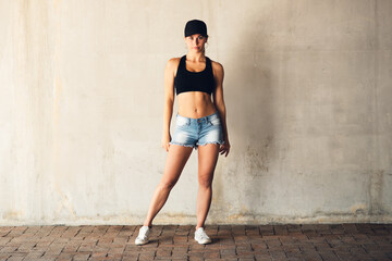 Shes always ready to bust a move. Shot of an attractive young female street dancer practising out...