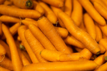 Lots of carrots. Food high in vitamin A. Vegetables on market.