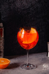 Glass of cold Aperol spritz cocktail.