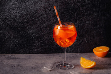 Glass of cold Aperol spritz cocktail.