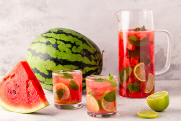 Fresh tasty delicious watermelon lemonade on a light background
