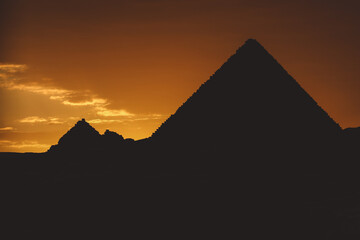 Sunset View to the One of the Wonders of the Ancient World - Great Pyramids of Giza with Colorful...