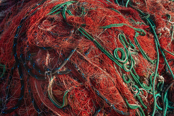 Fishing nets and ropes in contrasty colors. Red and green.