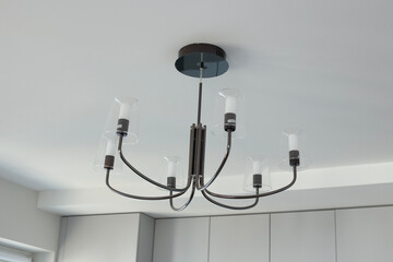 Chandelier with many light bulbs on the ceiling