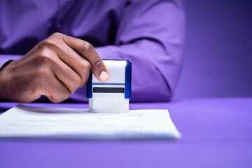 African American Black Man Using Notary Stamp
