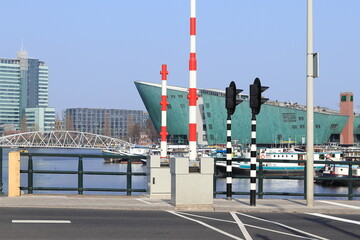 Amsterdam Oosterdok View with Modern Architecture, Bridge and Boats, Netherlands