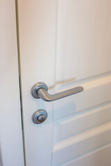 White door and silver doorknob in the apartment