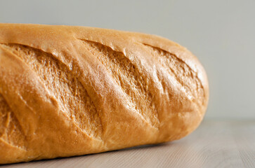 British White Bloomer or European sourdough. Baton loaf bread on a neutral background. Fresh loaf bread.