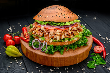 Sandwich with grilled chicken and vegetables. Burger.