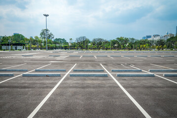 Empty space in outdoor asphalt car parking lot. Transportation concept.