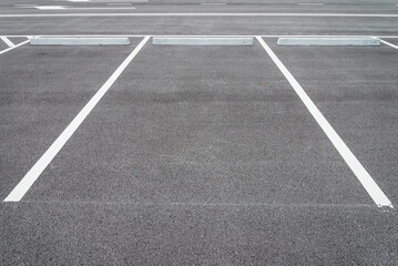 Empty space in outdoor asphalt car parking lot. Transportation concept. - obrazy, fototapety, plakaty
