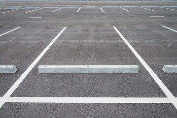Empty space in outdoor asphalt car parking lot. Transportation concept.