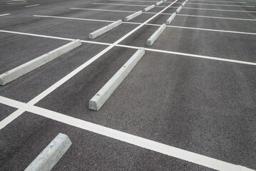 Empty space in outdoor asphalt car parking lot. Transportation concept.