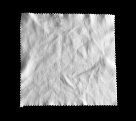 Fototapeta premium White crumpled napkin isolated on black