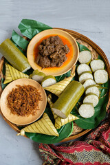 Traditional Muslim food popular among Malaysians. Lemang, Ketupat Palas, Beef Rendang and Beef Serunding Background. A dish eaten during Hari Raya