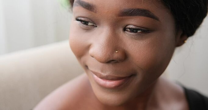 Face of thoughtful african american woman smiling