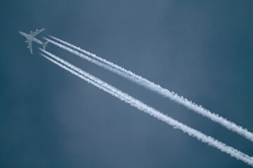 An airplane in dark blue sky