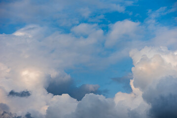 Fototapeta premium Stormy Clouds In The Blue Sky. Cyclone Coming. The Weather Is Getting Worse, Rain Is Coming.