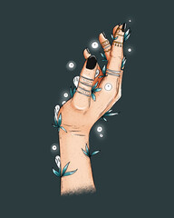 Female witch mystical hands with tatooes, rings, herbs and plants. Female magical hands with white spirits and white fireflights. Spellings, voodoo and magical rituals concept