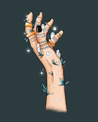 Female witch mystical hands with tatooes, rings, herbs and plants. Female magical hands with white spirits and white fireflights. Spellings, voodoo and magical rituals concept