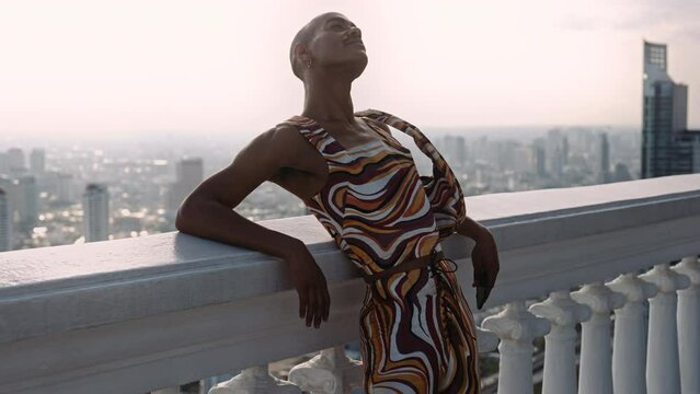 Fashion Model Posing In Swirled Pattern Clothes