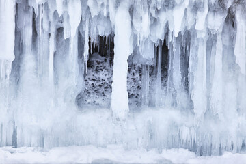 Frozen splash water on Baikal lake. Abstract winter background. Amazing scenery with frozen water