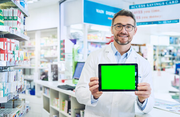 Too ashamed to explain your symptomsYou can do that online. Shot of a pharmacist holding up a tablet with a chromakey screen.