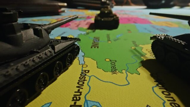 Toy tanks on the map. Military operations in Ukraine.