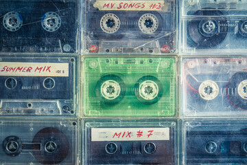 Old transparent audio cassettes arranged in a grid