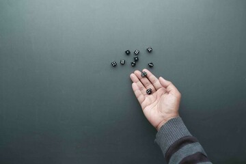 Black Dice trowing on black background top view 