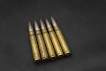 Vintage gun cartridges on black background