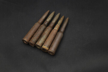 Vintage gun cartridges on black background