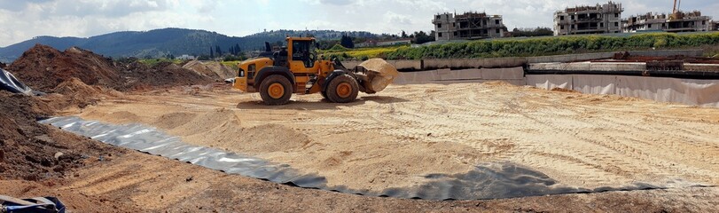 earthworks at a construction site, backfilling with inert material, replacement of clay soil,...