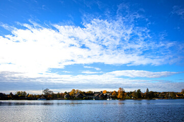 Lake Galvė Galwe in Lithuania Trakai Traki Litwa clear sky blue clouds boat tourism tourists sunny day landscape 