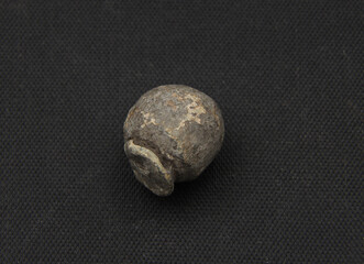 Fototapeta premium Medieval lead bullet on black background