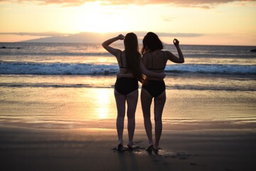 silhouette of a person on the beach at sunset
