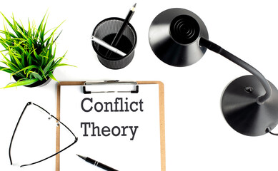 CONFLICT THEORY text on a clipboard on the white background
