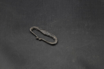 Ancient iron flint on black background