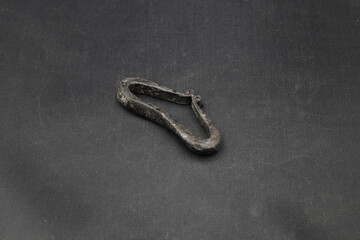 Ancient iron flint on black background