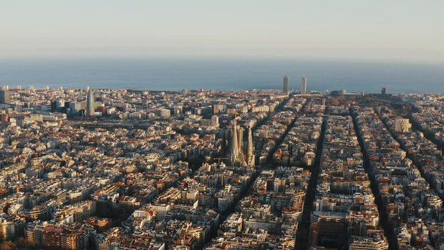 Aerial panoramic view on central part of Barselona. World famous places and points of interest Sagrada Familia, Torre Agbar, Hotel Arts, Torre Mapfre are seeing amidst residential and business areas