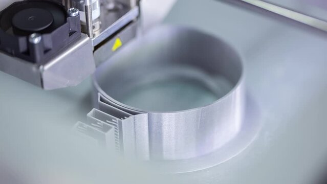 
3D printer working on a print plastic piece. Modern day technology
