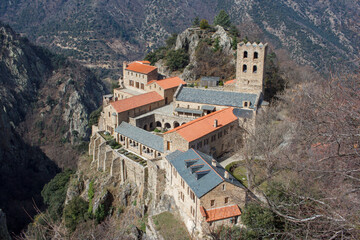 Fototapeta na wymiar postcard of monastery St Martin du Canigou in rock formation country