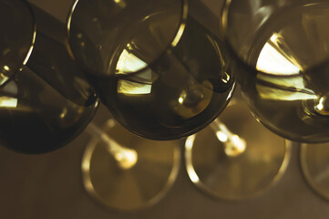 Glasses of wine arranged in a row, close up. Sepia filter