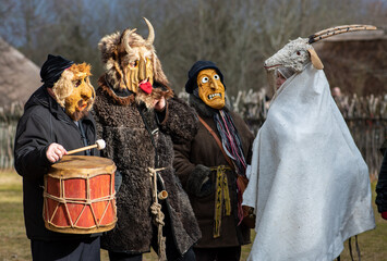Traditional masks in Rumsiskes, Lithuania during Uzgavenes, a Lithuanian folk festival during...